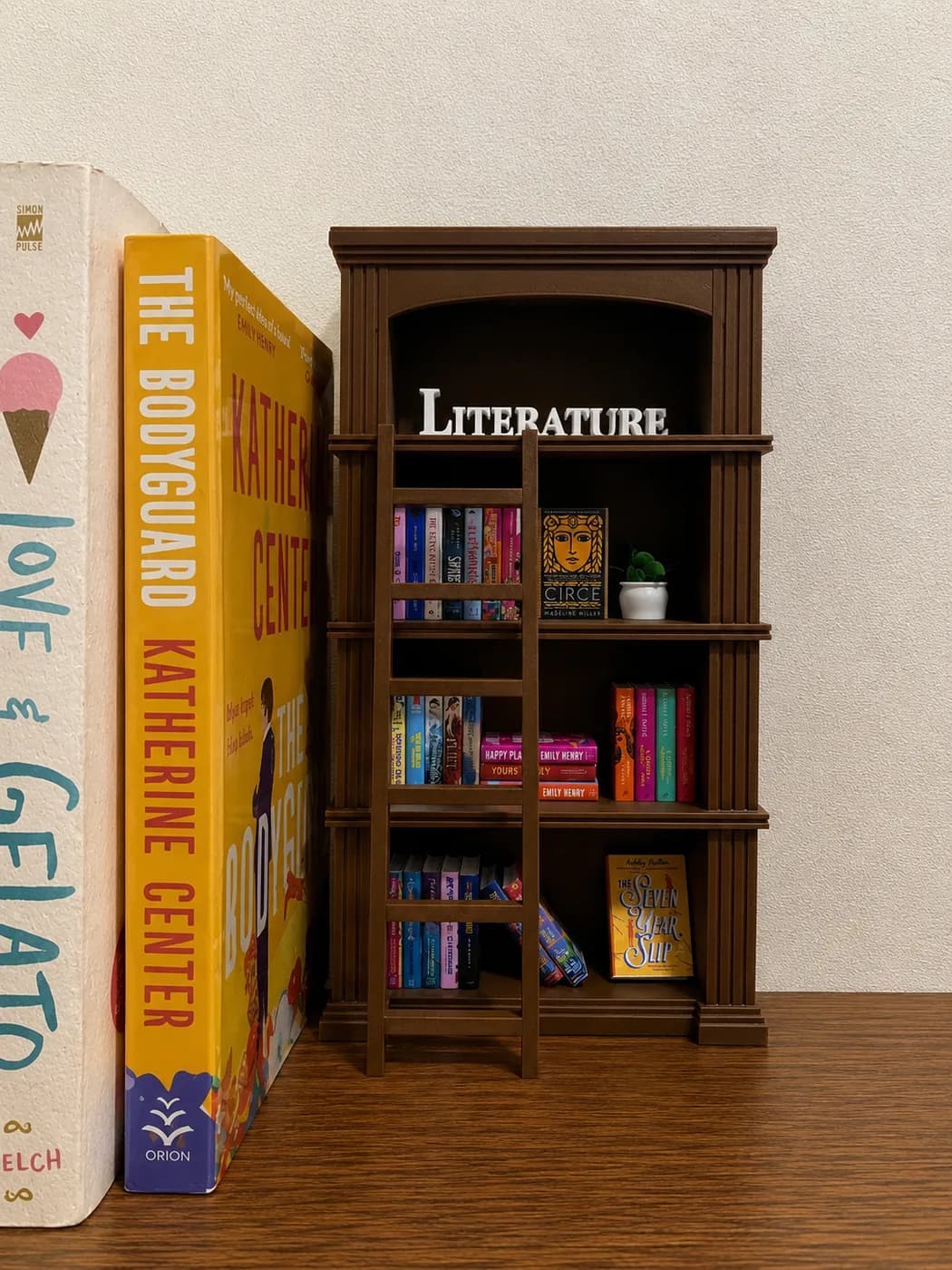 The little library ladder leaning against the side of a styled Classic bookshelf